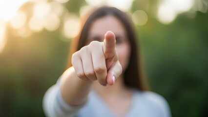 Woman pointing her finger in the air.