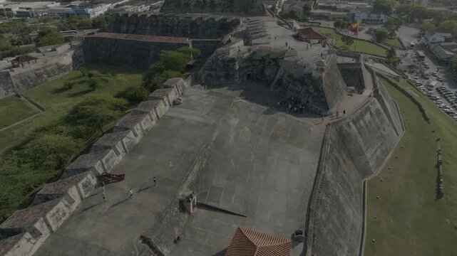 drone flying from west to east in castillo de san felipe cartagena during the day n finish going around the main tower overlooking the sea n the main tower amazing