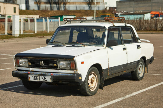 France, Paris, march 23,2025: VAZ LADA 2105 is an old, rusty, white Soviet car with homemade tuning.