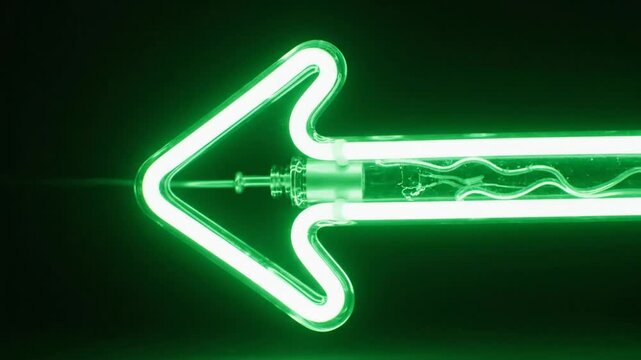 Green neon arrow light tube pointing left