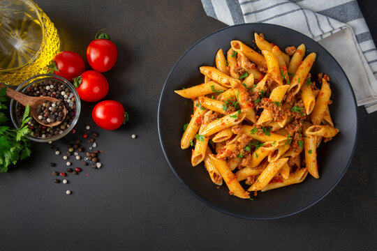 Penne pasta with minced meat and tomato sauce