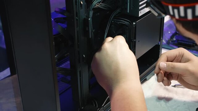 Connecting SATA cables to SSD and hard drive inside the PC case
