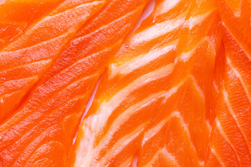 Close-up Texture of Fresh Raw Salmon Fillet Background,A high-detail macro shot showing the vibrant orange texture, natural fat marbling, and moist surface of a fresh raw salmon steak, ideal for food  © banjongseal324