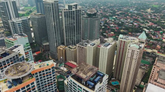 Tall residential and office towers cluster tightly in fast growing Metro Manila