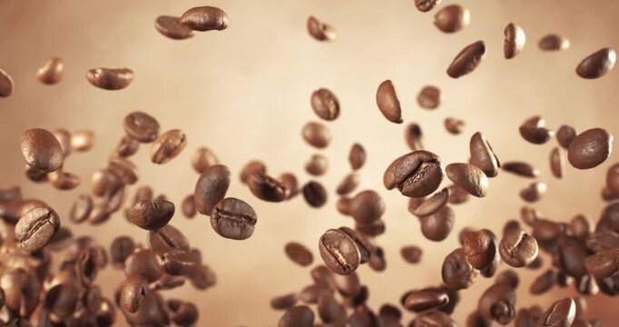 Fragrant coffee beans soar in the frame. Coffee beans shot on super slow motion camera 1000 fps.