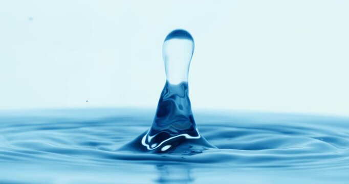 Drop of water falls into a drop of water in a super slow motion. Shot on super slow motion 1600 fps.