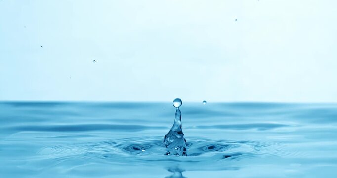 Drop of water falls into a drop of water in a super slow motion. Shot on super slow motion 1600 fps.