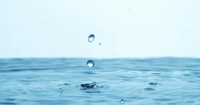 Water Drops close-up of water falls in a super slow motion. Shot on super slow motion camera 1600 fps.