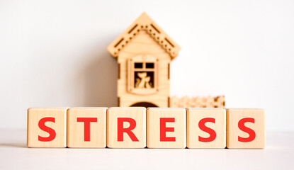 Stress word symbol. Concept word Stress on beautiful wooden blocks. Beautiful white background. Beautiful wooden model of house. Business psychological medical stress word concept. Copy space.
