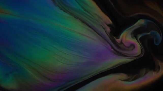 Subtle Organic Patterns Highlight the evolving, unrepeatable yet continuous patterns formed by the slow, natural spread of the iridescent liquid.