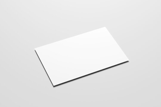 Blank white business card mockup with soft shadows isolated on a minimalist grey background. 3x2 inc