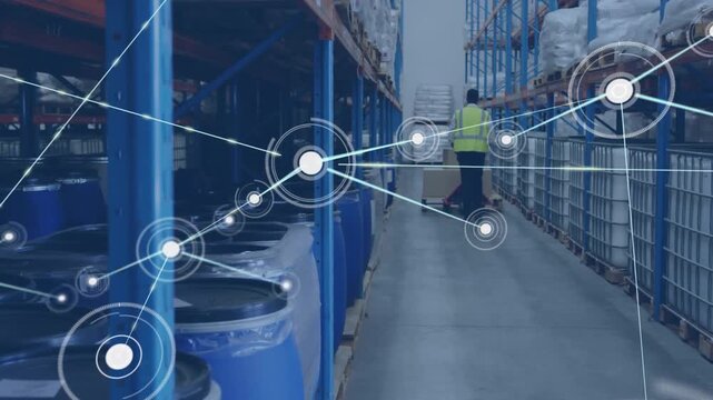 Animation of connected dots, rear view of african american man moving boxes on trolley in warehouse