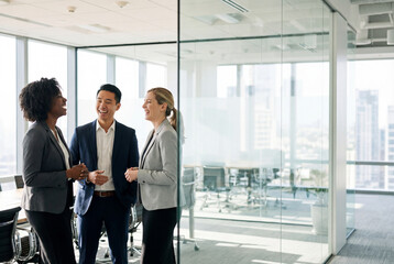 Fototapeta premium Diverse Business Team Discussing Strategy in Modern Sunny Office with Copy Space