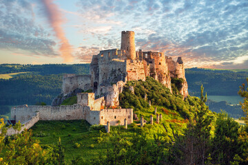 Spiš Castle (Spišský hrad) in Slovakia, a historic stone fortress perched on a hilltop, with panoramic views of the surrounding mountains. Dramatic sky, vibrant colors, and natural light highlight the © Rastislav Sedlak SK