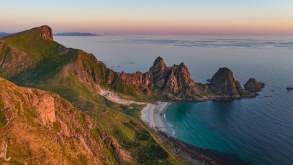 aerial, bird view Amazing rock formations near Matind, Måtind mountain, Otervika Beach near Bleik on Vesterålen, vesteralen islands during midnight sun. Sunset, Beautiful hiking destination in arctic  © Dirk