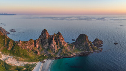aerial, bird view Amazing rock formations near Matind, Måtind mountain, Otervika Beach near Bleik on Vesterålen, vesteralen islands during midnight sun. Sunset, Beautiful hiking destination in arctic  © Dirk