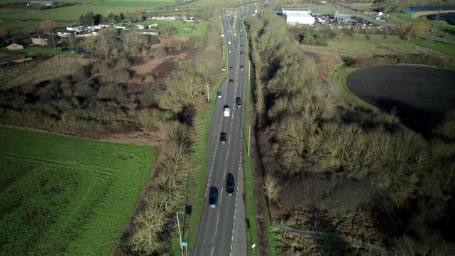 Top Down View Of Dual Carriageway Close To The A127 Motorway Of Oncoming Cars Passing By