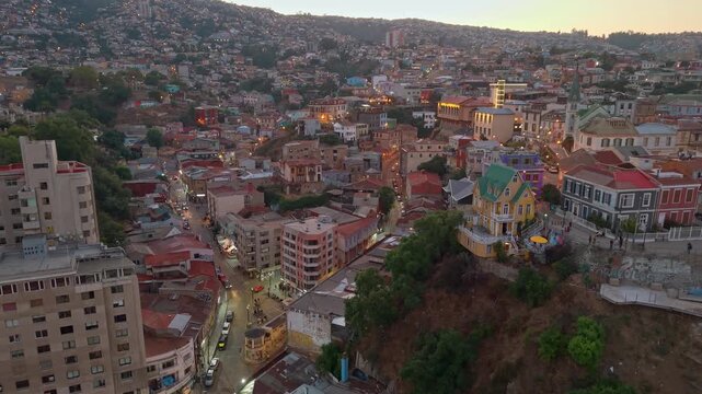 Panoramic aerial view of Cerro Concepcion with Paseo Atkinson and Cerro Alegre with Paseo Dimalow in the background, city of Valpara&iacute;so at sunset, Plaza Anibal Pinto, Chile