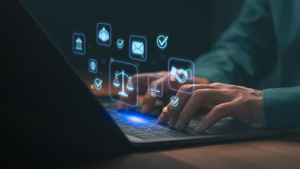 Lawyer using laptop for online legal services, business contract, and digital justice. Legal technology concept featuring attorney, scales of justice, compliance, and law firm icons. © ParinPIX