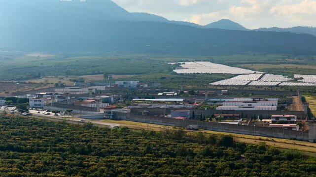 PGR penal facility in Ciudad Guzman, Jalisco, Mexico, with perimeter walls enclosing a correctional facility, representing themes of justice, confinement, and security