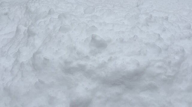 Macro shot of fresh snow texture. Clean white winter background with natural crystals and soft minimal surface.