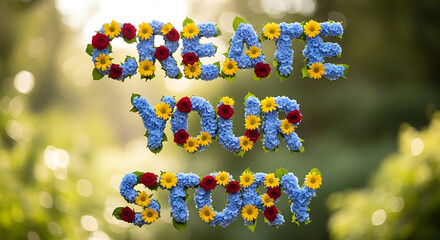 Floral arrangement forming inspirational quote in a lush green garden with vibrant flowers and natural sunlight