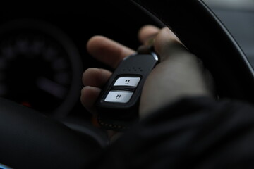 Obraz premium An auto alarm remote control is an electronic device for monitoring and controlling the operation of devices, processes, and security.