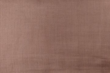 Fototapeta premium Top view of flat brown linen fabric texture for background.