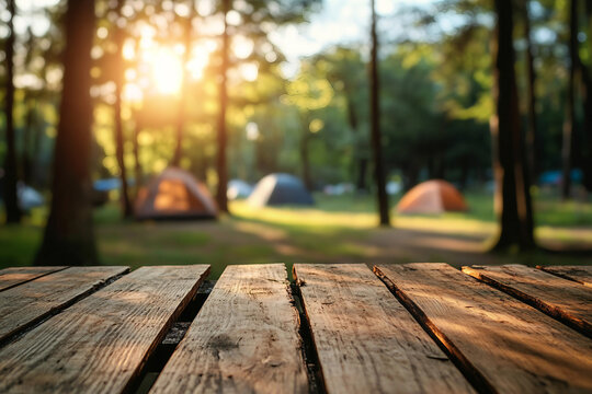 Scenic forest camping site with glowing evening sunset and wooden table surface in focus, generative ai
