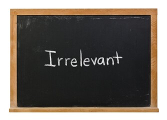 Obraz premium Irrelevant hand written in white chalk on a black chalkboard isolated on white in a wooden frame