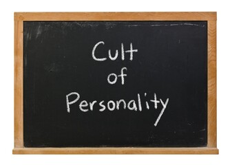 Obraz premium Cult of Personality hand written in white chalk on a black chalkboard isolated on white in a wooden frame