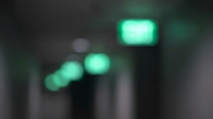 Naklejka premium Abstract Green Bokeh Lights in Dark Corridor