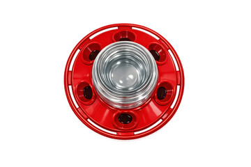 Red automatic poultry feeder with clear water reservoir and feeding ports