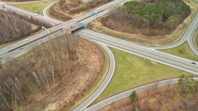 Aerial Drone View of Highway Interchange with Curved Ramps in Autumn