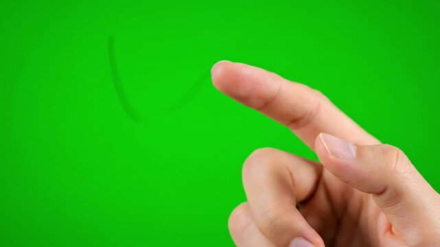Hand pointing upwards against green screen background