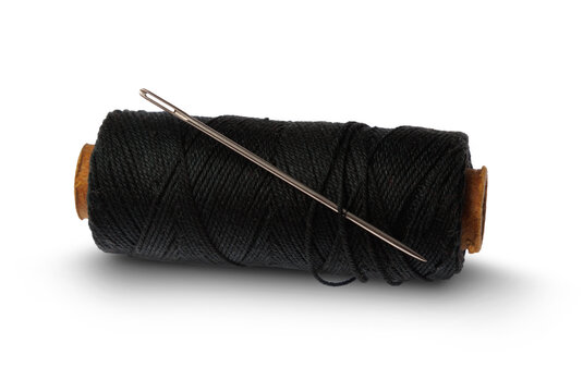 A roll of black thread with a needle isolated on a transparent background