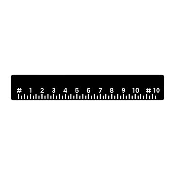 A black ruler displays measurements from one to ten a stark silhouette