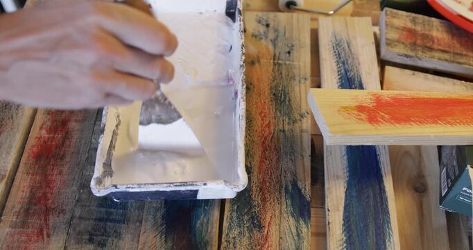 Water based acrylic protective primer coat thinned in plastic pot using spatula