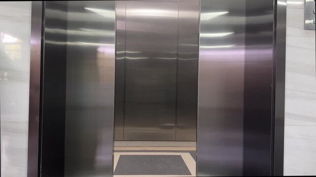 Elevator Doors Opening in Modern Office Building Interior