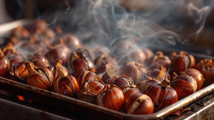 Roasted chestnuts emit fragrant steam on a metal tray, ready to be enjoyed as a warm, comforting autumn snack.