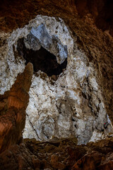 Obraz premium The Frasassi Caves are underground karst caves located in the municipality of Genga, in the province of Ancona, within the Gola della Rossa and Frasassi Regional Natural Park.