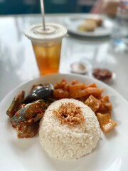 Plate of Nasi Lemak with Iced Tea