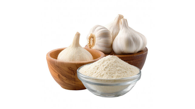 A close-up shot of fresh garlic bulbs and minced garlic in wooden bowls and a glass dish