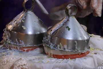 Thai Steamed Rice-Skin Dumplings (Khao Kriab Pak Mor) Being Prepared with Metal Conical Steamers at a Street Food Market. © Leiter1940s