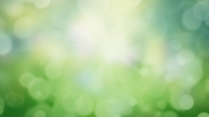 Sunny spring meadow blur background, blue sky and green grass