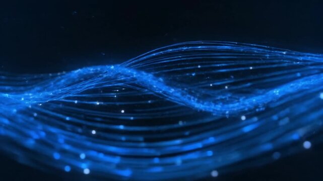 Abstract flowing blue data lines with glowing particles creating a dynamic wave pattern on a dark background, ideal for technology presentations or digital overlays.