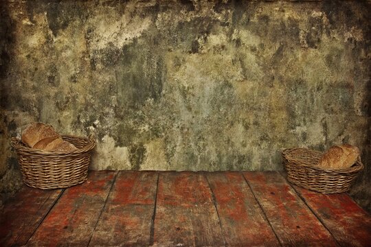 blurred bakery background, Artisan loaves of bread and wheat ears on dark brown background.
