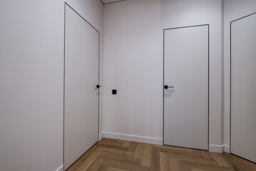 long empty corridor in interior of entrance hall of modern apartments, office or clinic