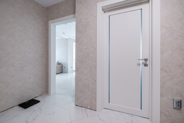 long empty corridor in interior of entrance hall of modern apartments, office or clinic