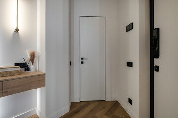 long empty corridor in interior of entrance hall of modern apartments, office or clinic